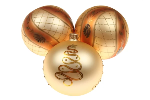 Drie gouden kerstballen — Stockfoto