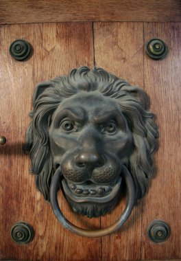 Metal door knocker as lion clipart