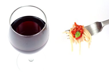 Glass of red wine and fork with spaghett clipart