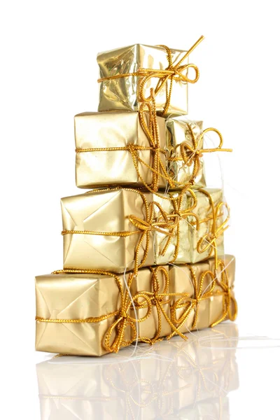 Gold gift rapped parcel pyramid — Stock Photo, Image