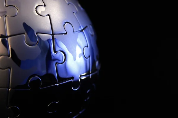Globe jigsaw completed with blue tint — Stock Photo, Image