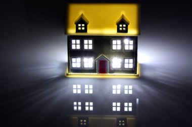 One house lit at night clipart