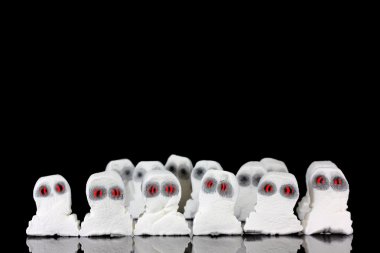 Evil white ghosts in a crowd clipart
