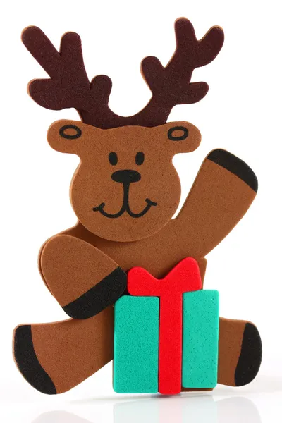 stock image Reindeer sitting with a present