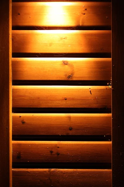 Spot light on wooden lodge wall — Stock Photo, Image