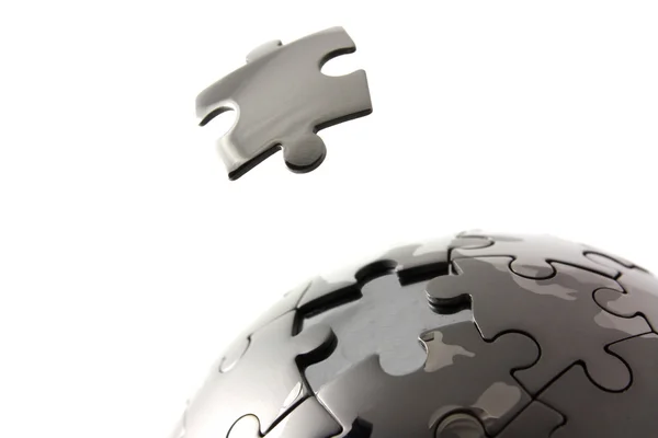 Puzzle globo con pezzo galleggiante — Foto Stock