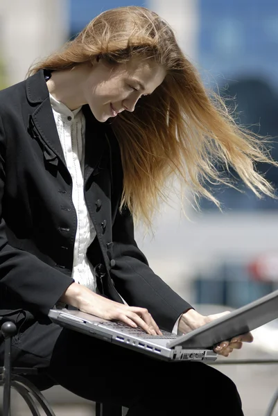 Young undergraduate with laptop — Stock Photo, Image