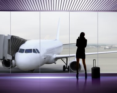 Silhouette of woman at the airport clipart