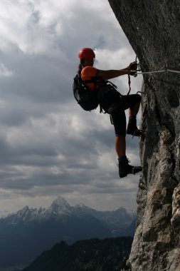 Extreme sport - silhouette of a climber clipart