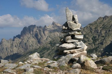 Stone man in the mountains clipart