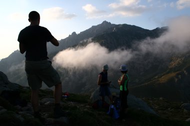 Hikers in the mountains clipart