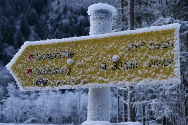 Frozen tourist sign — Stock Photo, Image