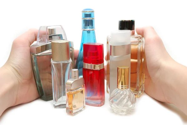 Hand gathering in bottles of perfume — Stock Photo, Image