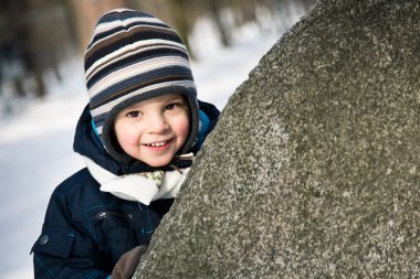 Baby peep out of the stone clipart