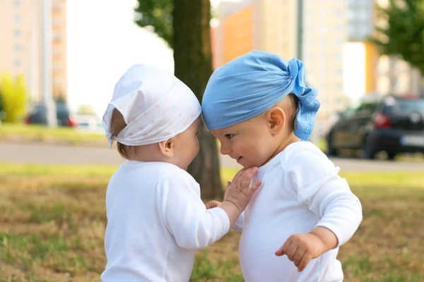 Small girl putting her hand on the boy — Stock Photo, Image