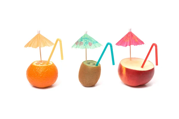 Kiwi, mandarin and apple with umbrellas — Stock Photo, Image