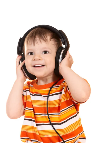 Bébé souriant avec écouteurs — Photo