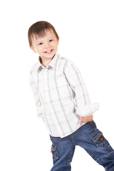 Usmívající se dítě v košili a džínách — Stock fotografie