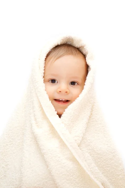 Smiling baby in towel Stock Photo