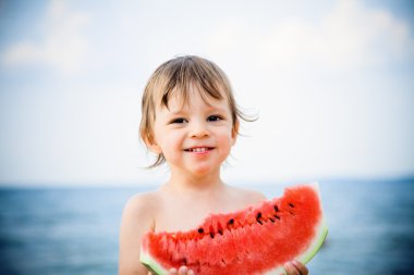 Boy eating watermelon