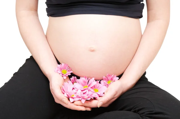 妊娠中の花を持つ女性 — ストック写真