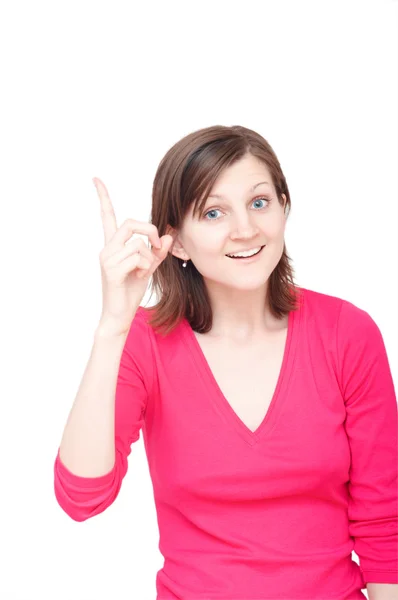 Usmívající se žena ukazující prst — Stock fotografie