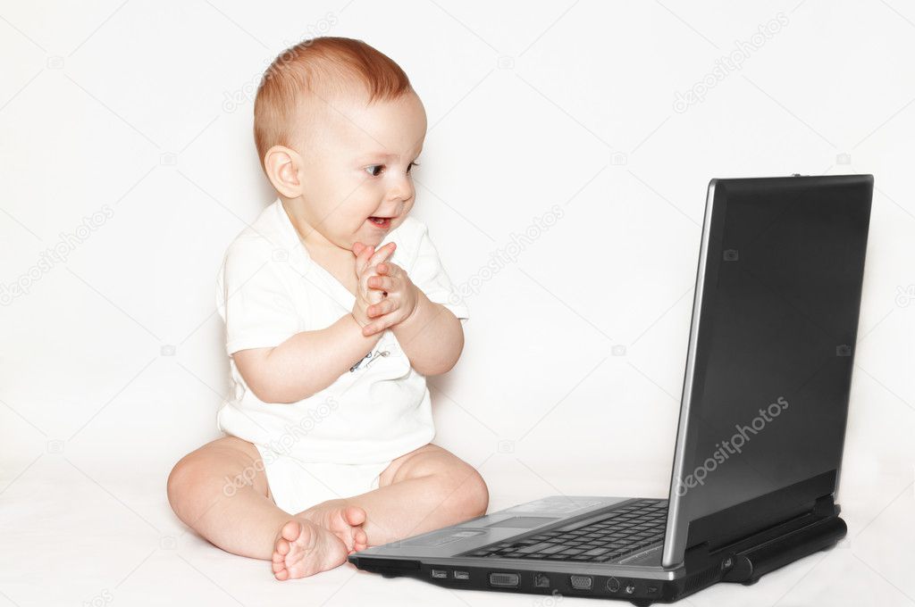 Clapping baby with laptop