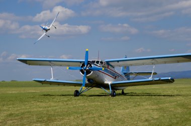 Biplane An-2 in the airshow clipart