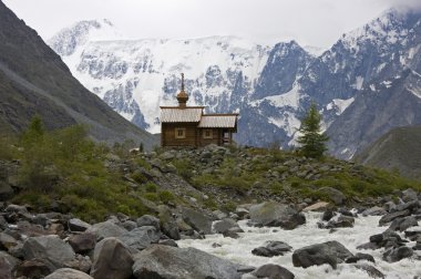 Orthodox chapel in Altai mountains clipart