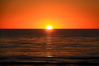Setting Sun on Ocean Horizon clipart