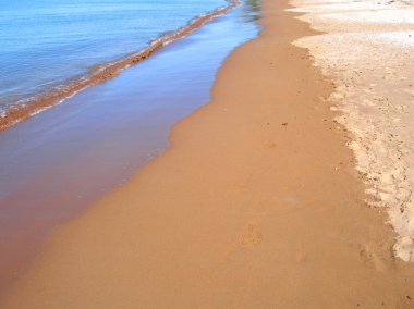 Retreating waters along Beach