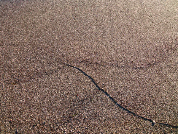 Текстура и фон песчаного пляжа — стоковое фото
