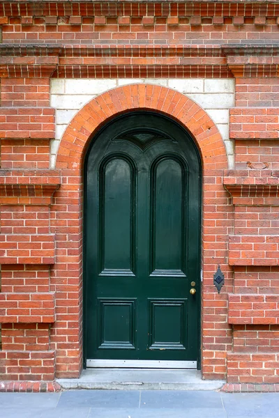 Heritage Door in Decorative Brick Wall — Stock Photo, Image