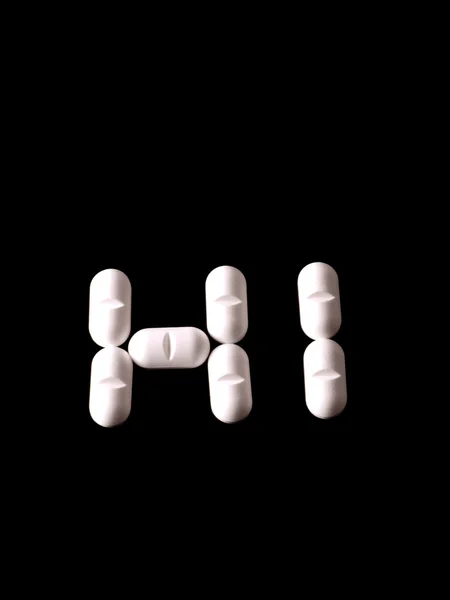 Pillen op zwart — Stockfoto
