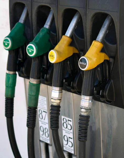 Green and yellow gas pump rack — Stock Photo, Image