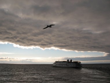 Motor ship in Lake Ladoga. Evening clipart
