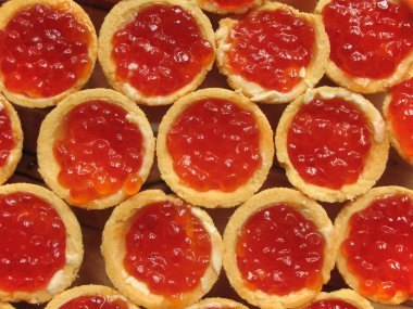 Red caviar in a tartlet. Selective Focus clipart