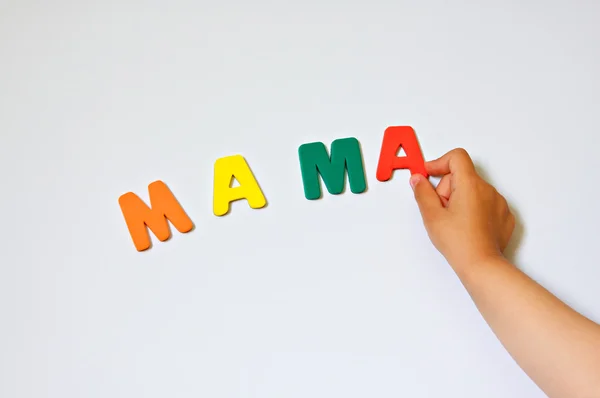 stock image Child hand writing word Mama