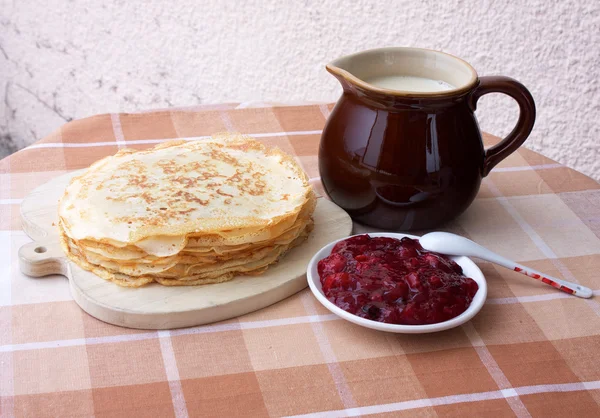 Blini with milk and berry jelly — Stock Photo, Image