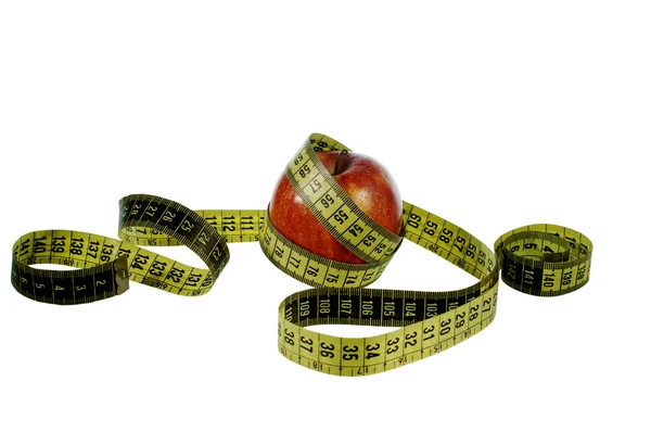 Manzana roja con cinta métrica —  Fotos de Stock