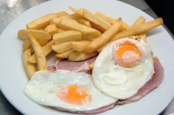 stock image Close up of Ham, egg and chips. A traditional British Cafe Dish