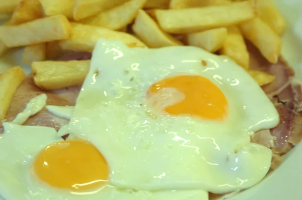 Stock image Close up of Ham, egg and chips. A traditional British Cafe Dish