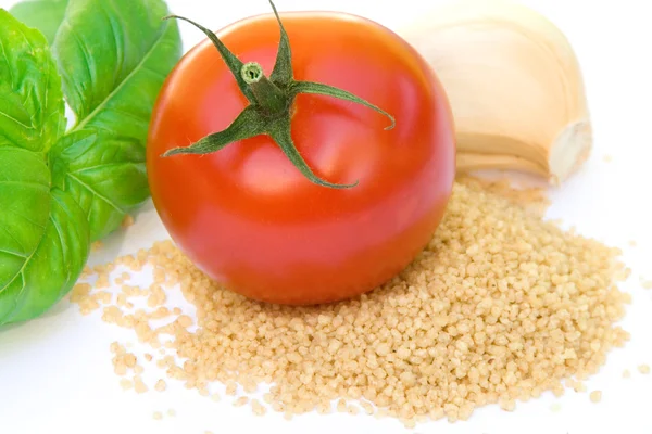 Couscous, tomato, basil, and garlic — Stock Photo, Image