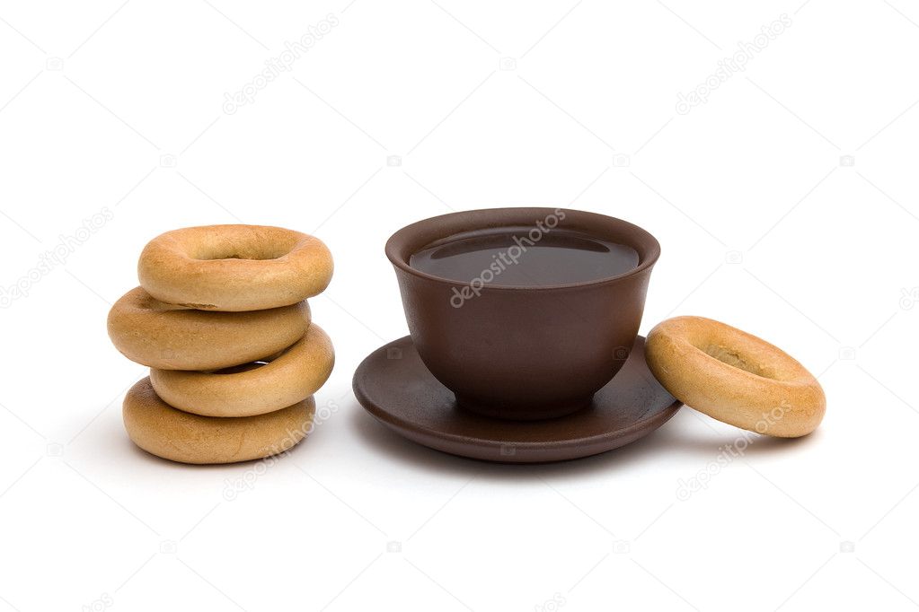 The cup of tea and donuts