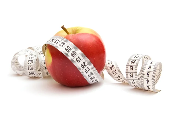 Red apple and measuring tape — Stock Photo, Image