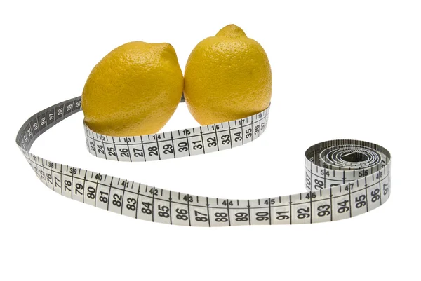 stock image Two lemons and a measuring tape