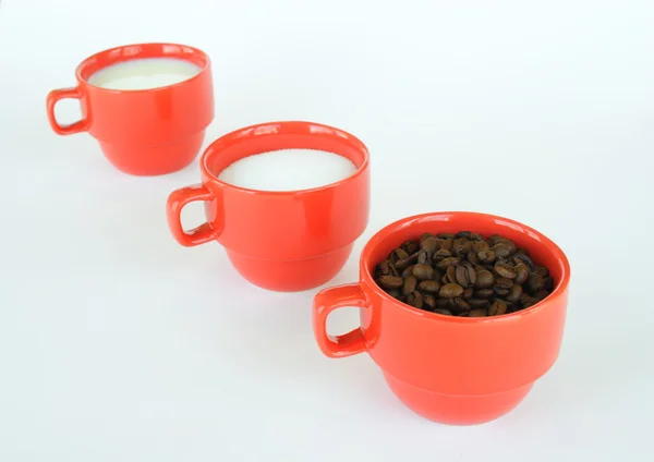 Three cups with coffee sugar and milk — Stock Photo, Image