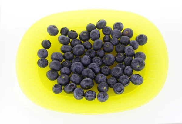 stock image Blueberries on yellow plate