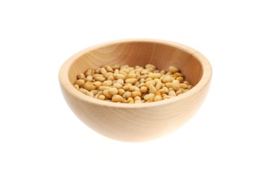 Pine nuts in a wood bowl clipart