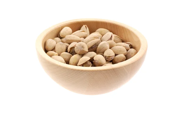 stock image Pistachios in a wood bowl